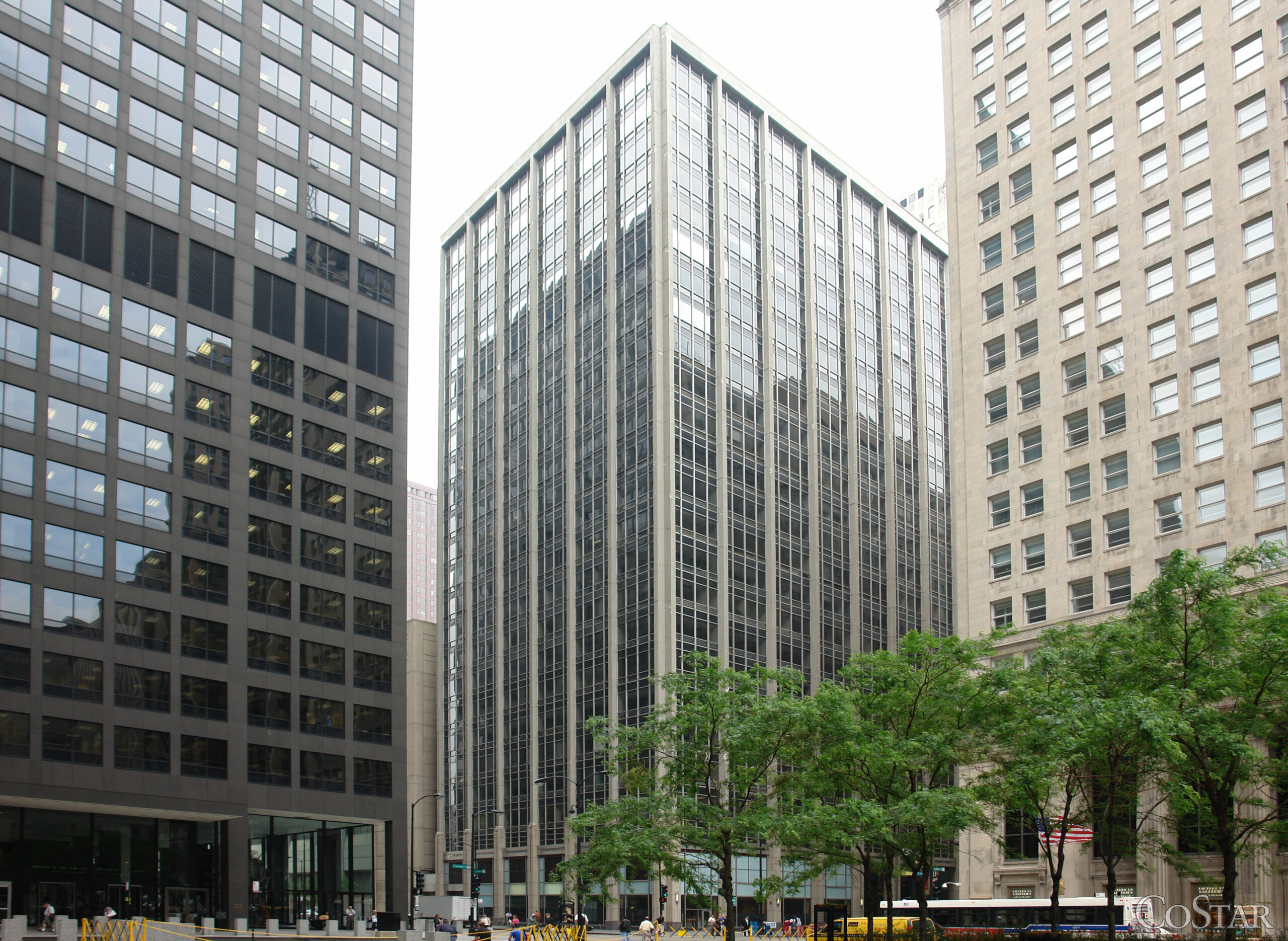 Exterior view of 111 W. Jackson Blvd., Chicago, IL 60604, a modern office building in the heart of Chicago’s Financial District, surrounded by neighboring high-rises.