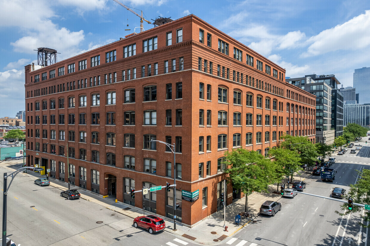 Exterior view of 954 W. Washington Blvd., Chicago, IL 60607, a historic brick building in the vibrant Fulton Market district.